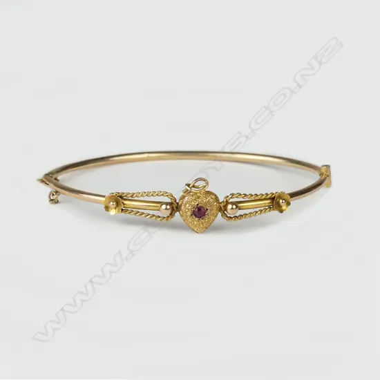 An Edwardian 9ct. gold half-hinged bangle