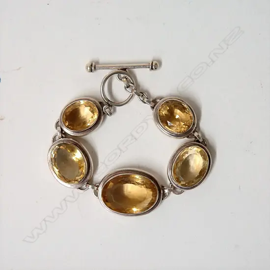 A lady's modern citrine and silver bracelet