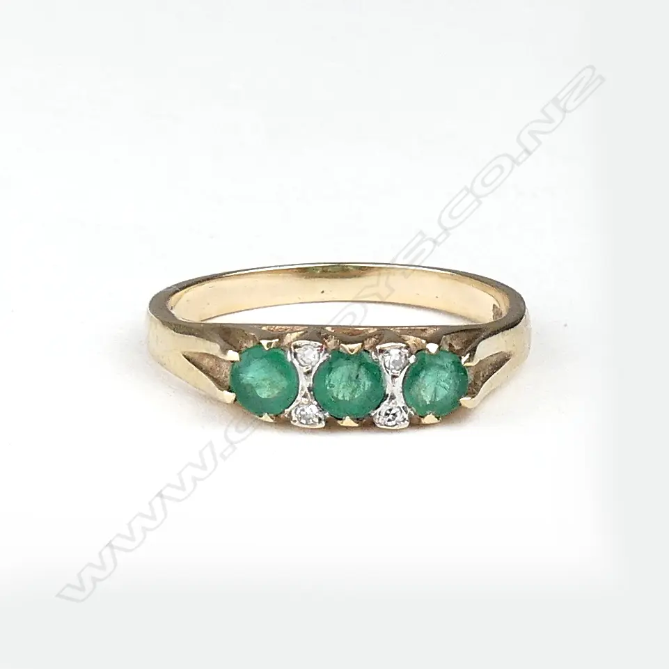 A 9ct gold emerald and diamond ring Image 1++