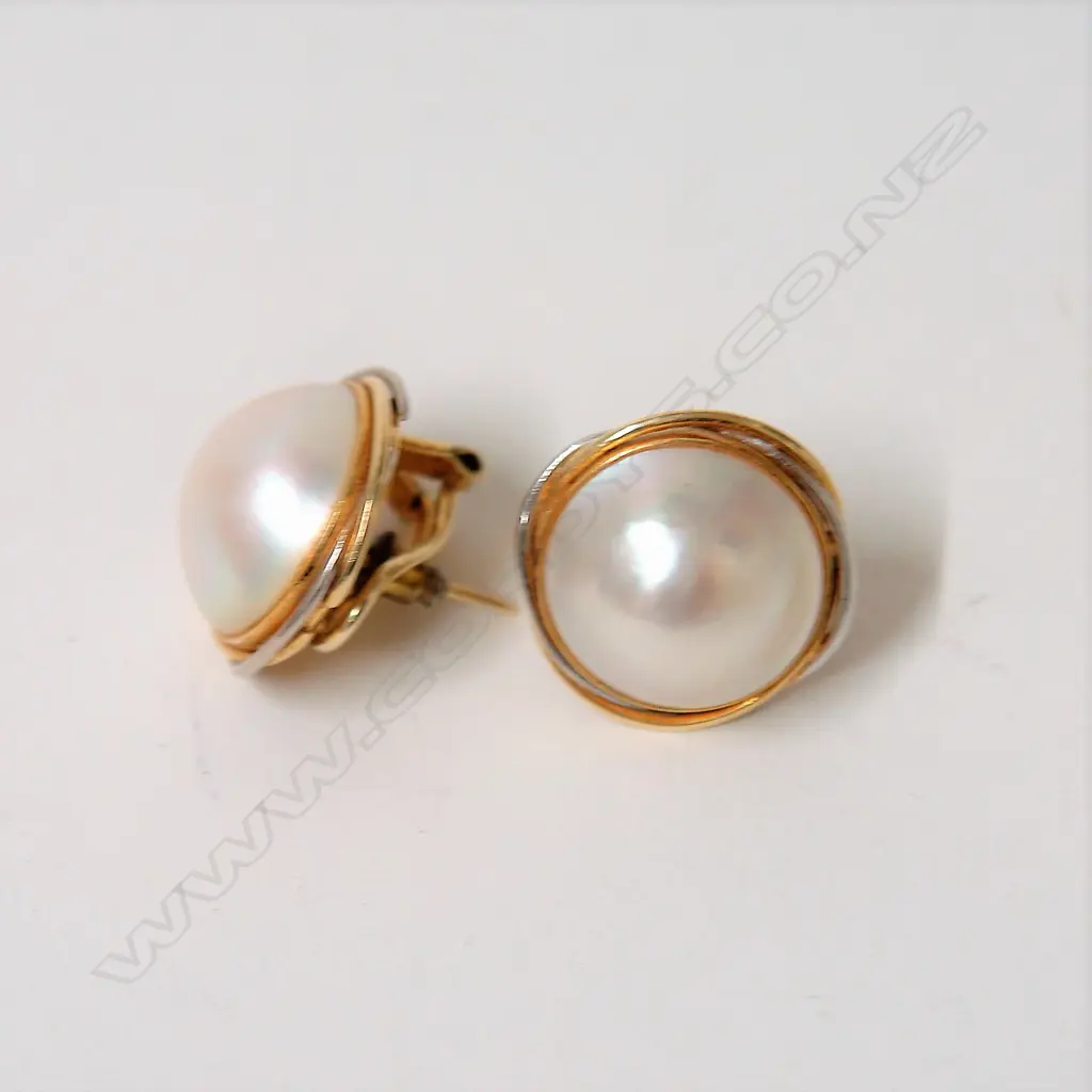 A pair of 14ct. yellow and white gold large pearl earrings Image 1++