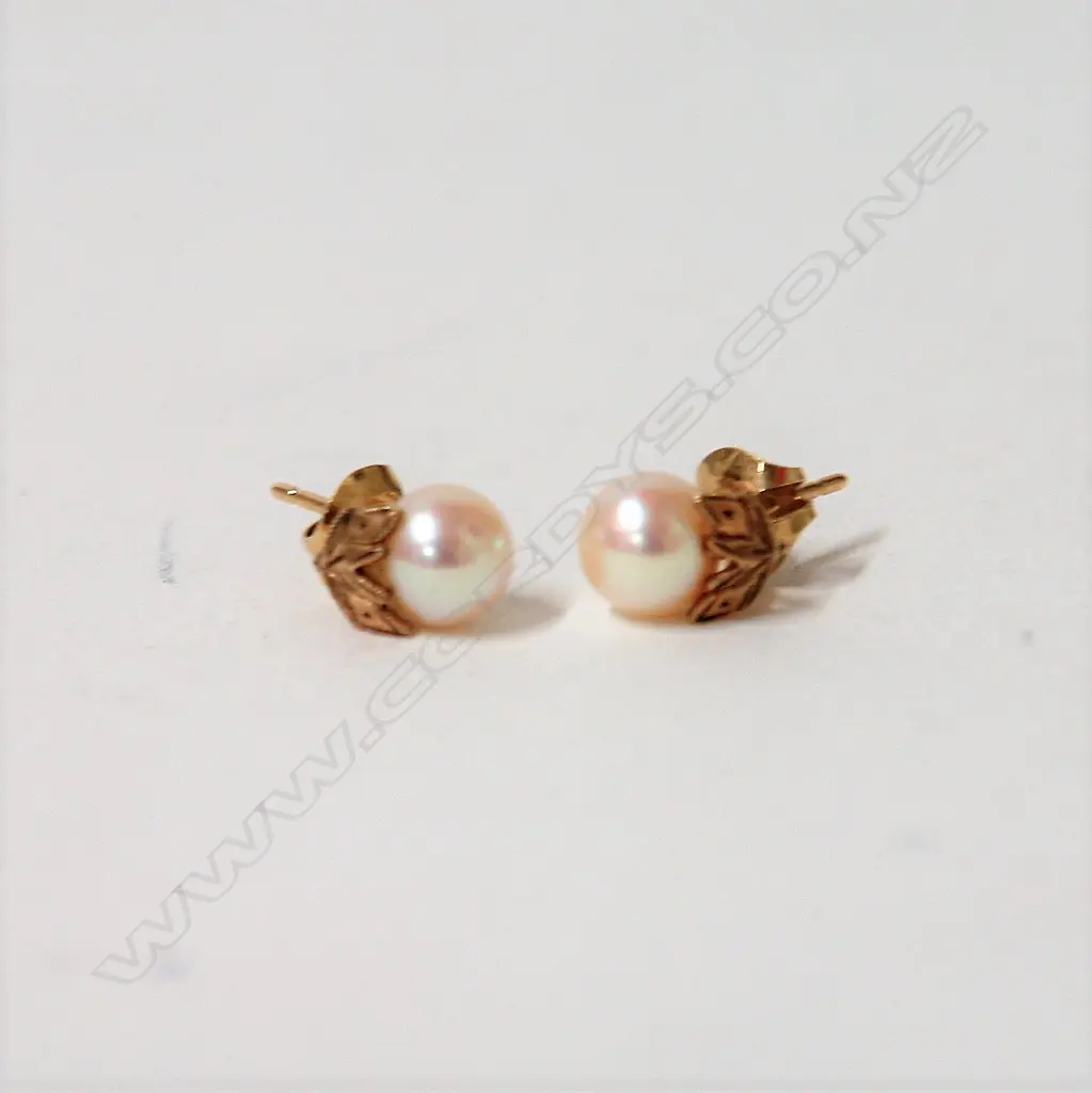 A pair of 14ct. yellow gold and Mikimoto pearl earrings Image 1++