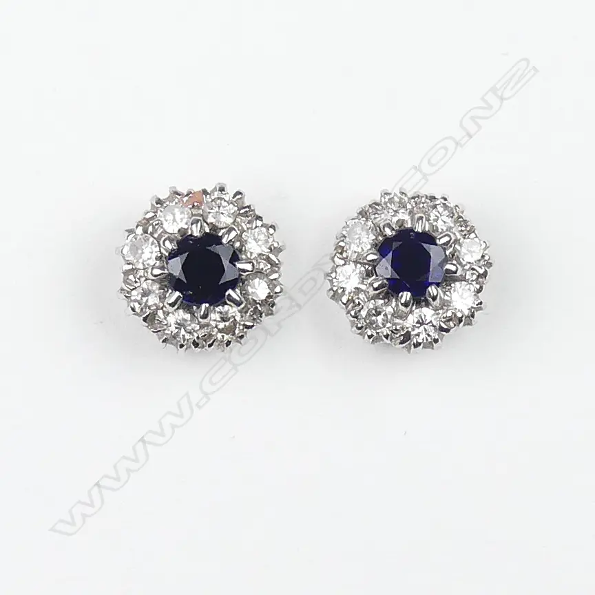 A pair of 18ct white gold sapphire and diamond stud earrings Image 1++