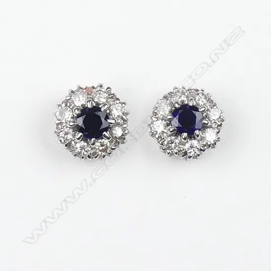 A pair of 18ct white gold sapphire and diamond stud earrings