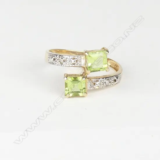 A 10ct. yellow gold peridot and diamond ring