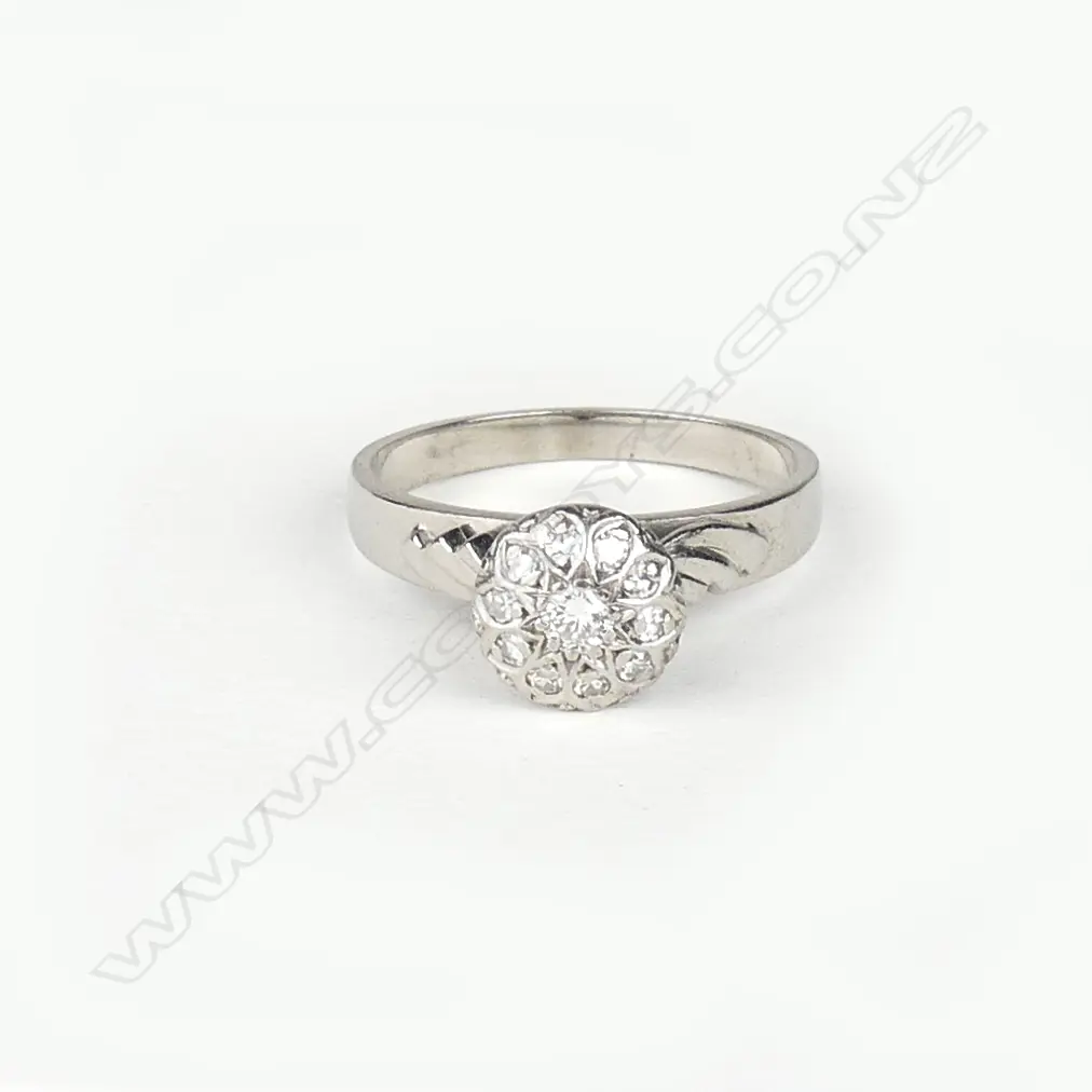 An 18ct. white gold and diamond cluster ring Image 1++