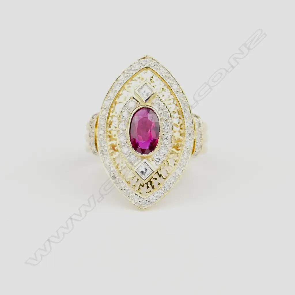 An 18ct. gold ruby and diamond dress ring Image 1++