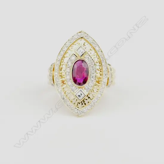 An 18ct. gold ruby and diamond dress ring
