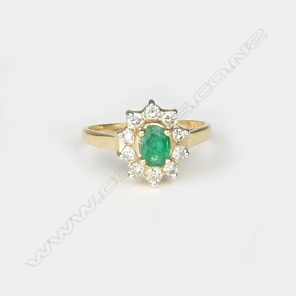 A 14ct gold emerald and diamond ring Image 1++