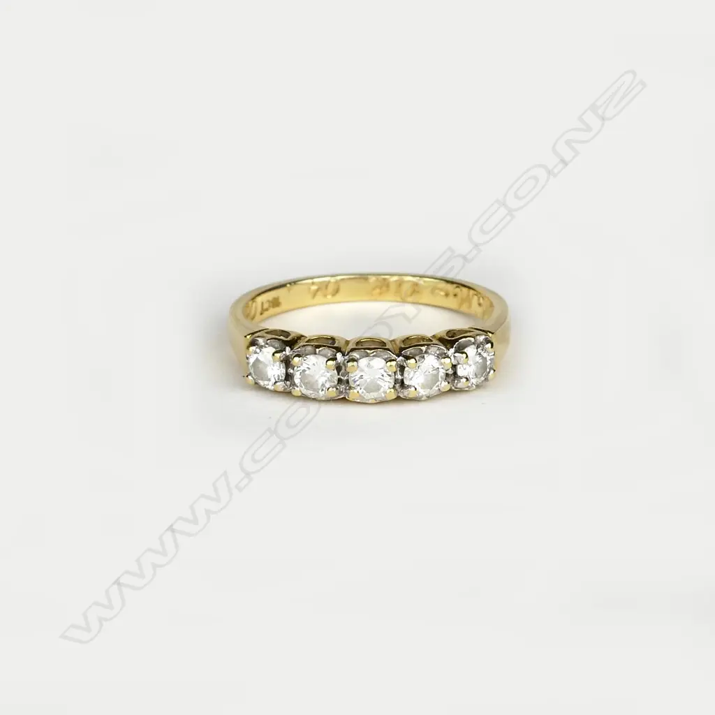 An 18ct. gold and five stone diamond ring Image 1++
