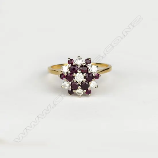 An 18ct. gold ruby and diamond cluster ring