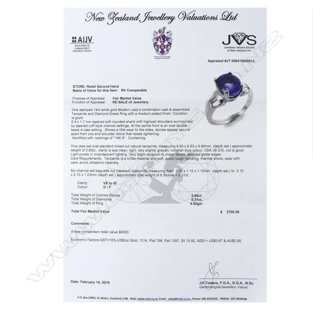 A 14ct white gold tanzanite and diamond ring Image 1++