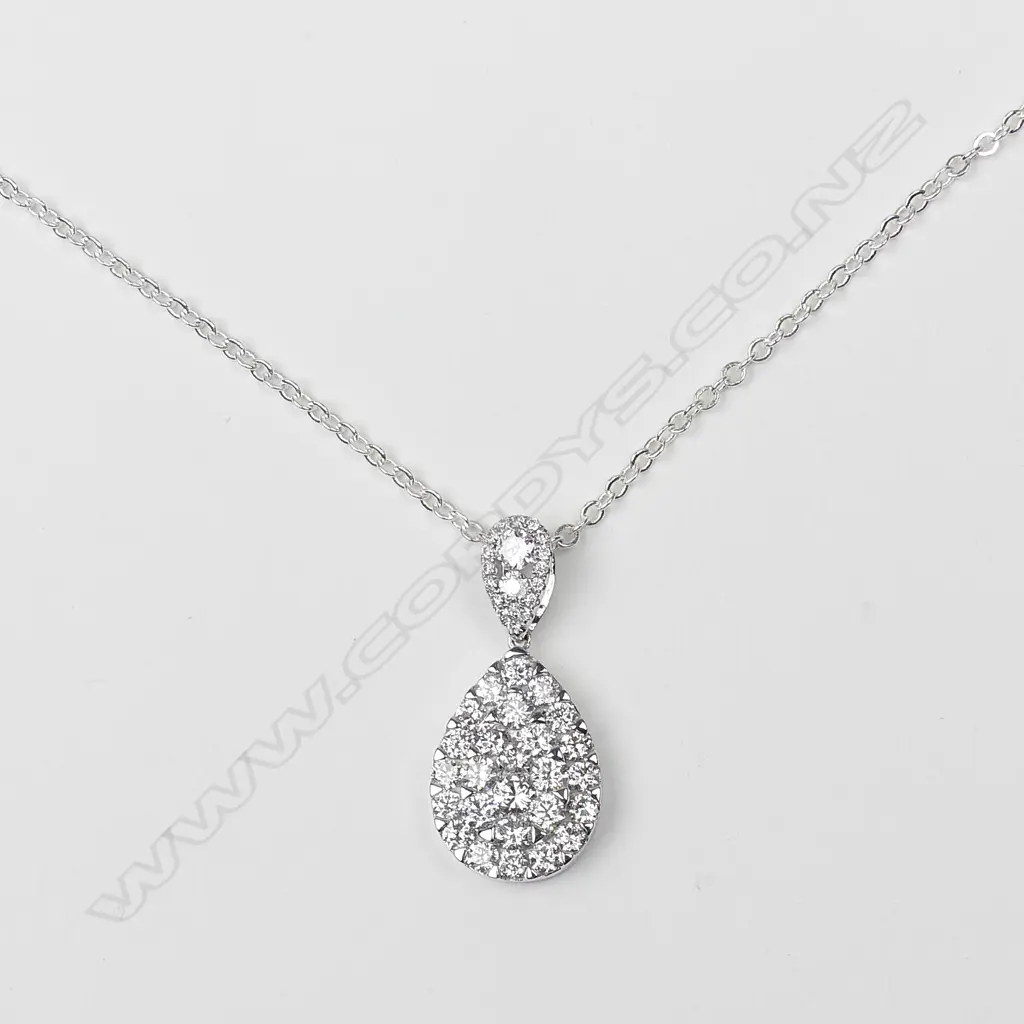 An 18ct. white gold and diamond pendant on chain Image 1++
