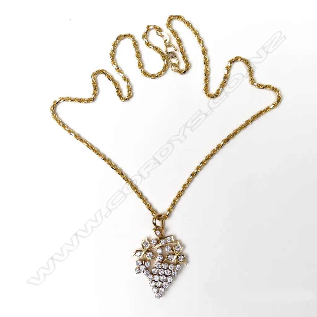 A 20ct gold and diamond pendant Image 1++