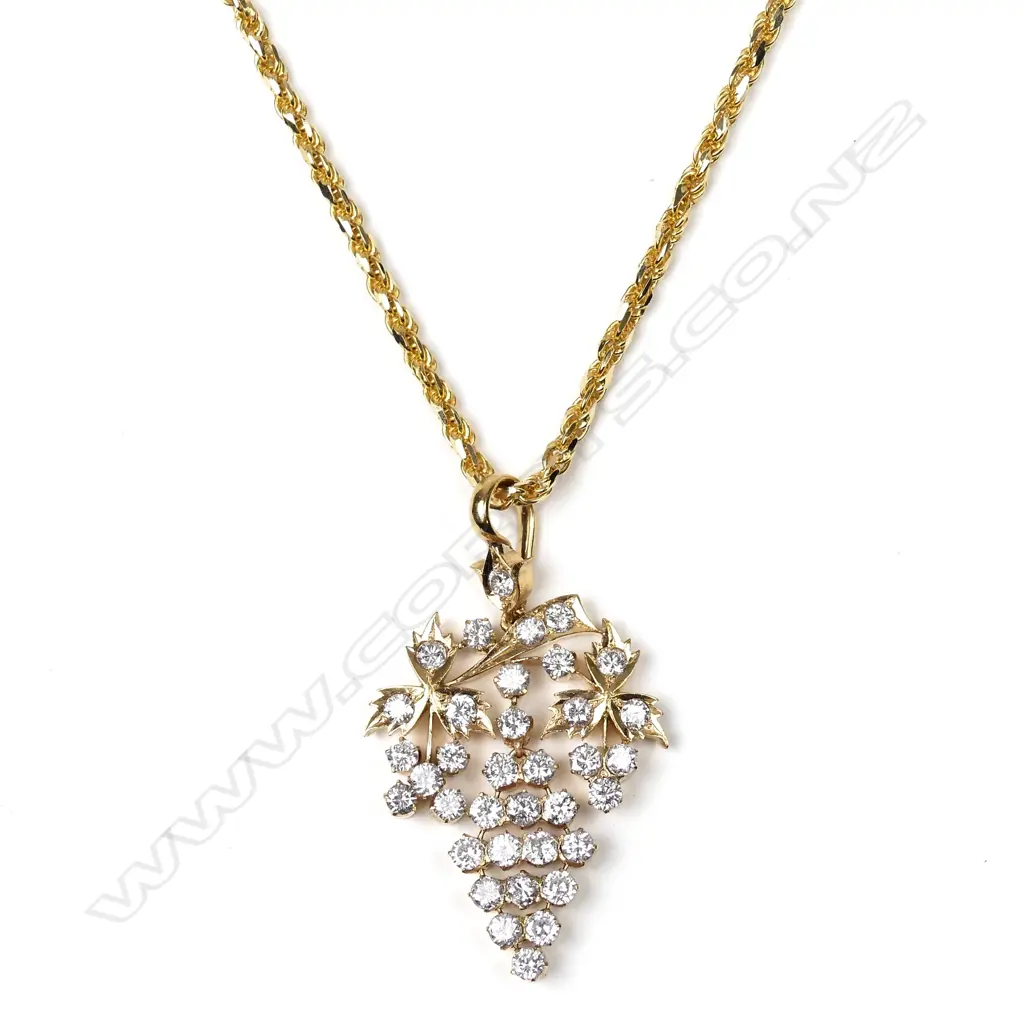 A 20ct gold and diamond pendant Image 1++