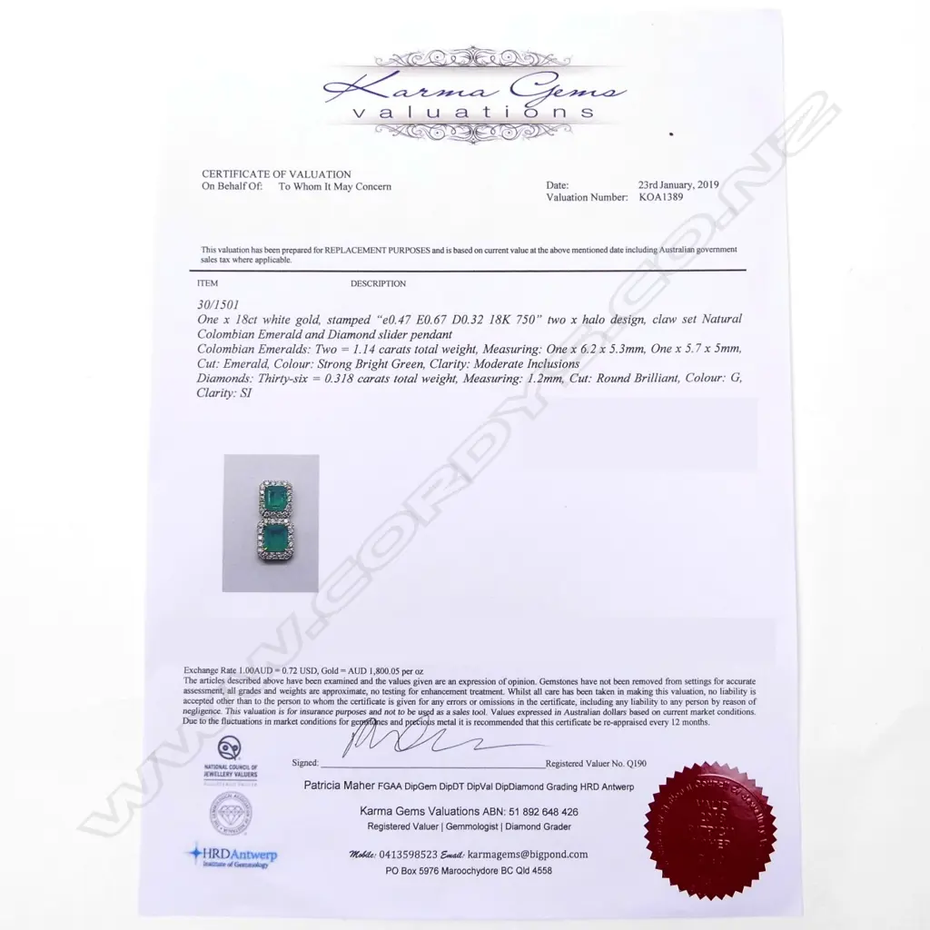 An 18ct white gold emerald and diamond pendant Image 1++
