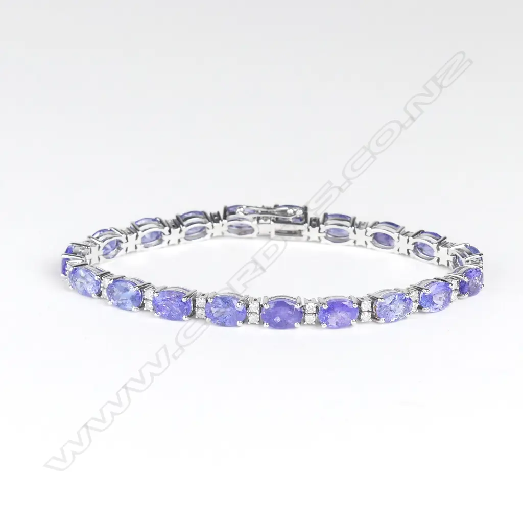 A 14ct white gold tanzanite and diamond tennis bracelet Image 1++