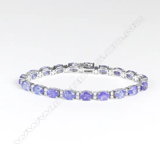 A 14ct white gold tanzanite and diamond tennis bracelet