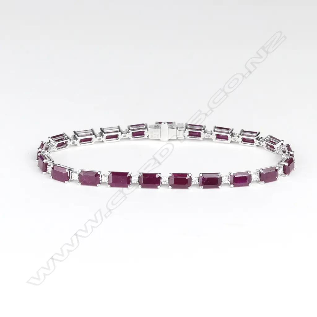 An 18ct white gold ruby and diamond tennis bracelet Image 1++