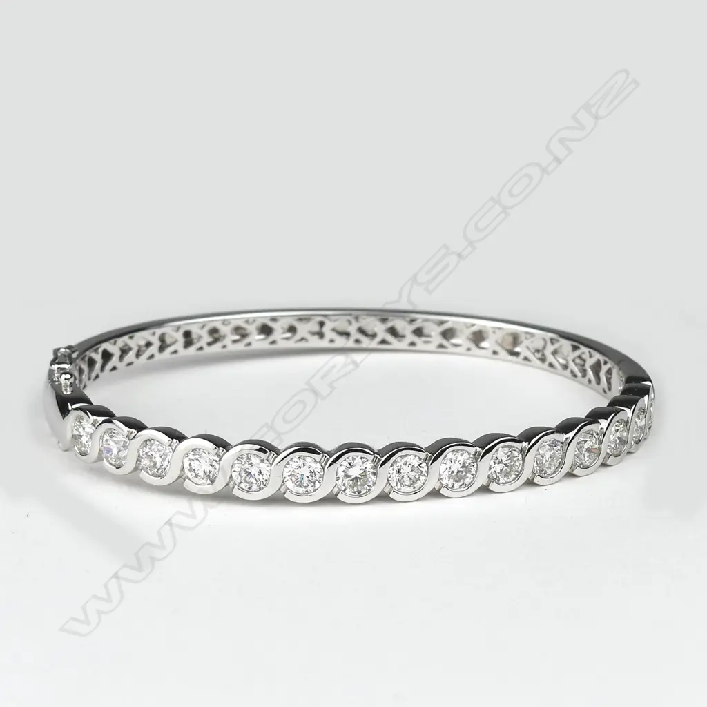 An impressive lady's modern 18ct. white gold and diamond set bangle Image 1++
