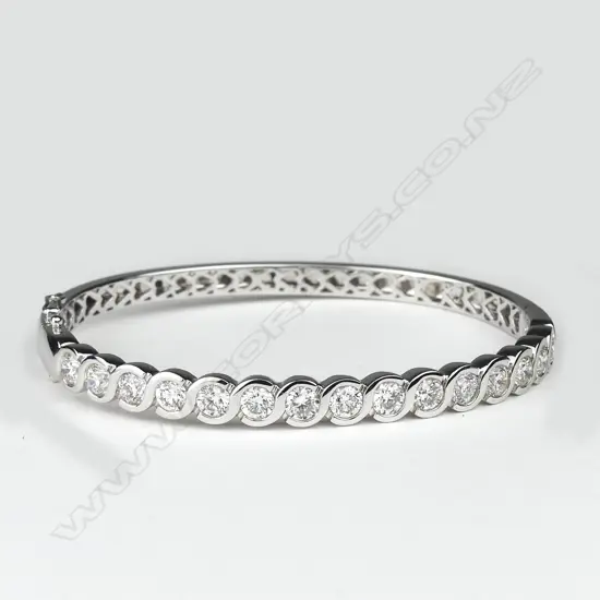 An impressive lady's modern 18ct. white gold and diamond set bangle