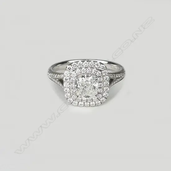 An 18ct. lady's modern white gold diamond cluster ring