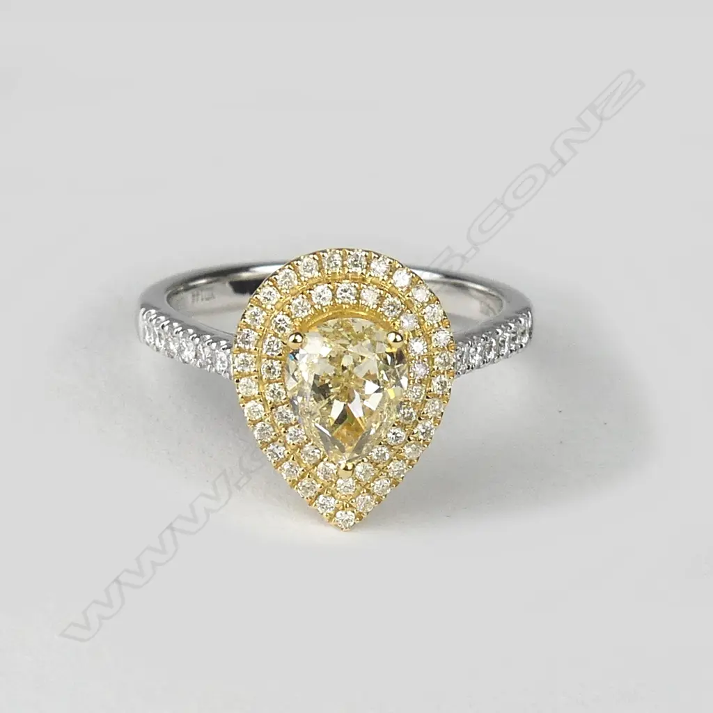 A lady's modern 18ct. white and yellow gold 1.44ct. yellow diamond and cluster ring Image 1++