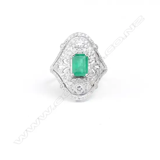 An 18ct white gold emerald and diamond Art Deco style ring