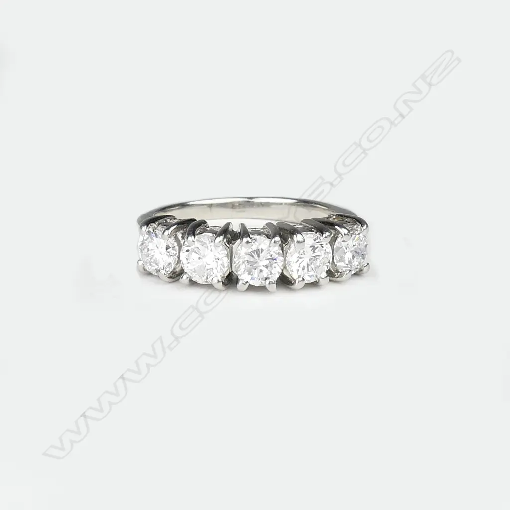 A platinum and five stone diamond ring Image 1++