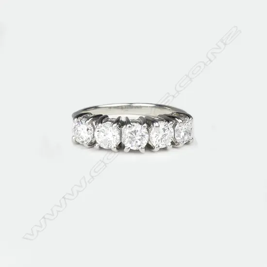 A platinum and five stone diamond ring