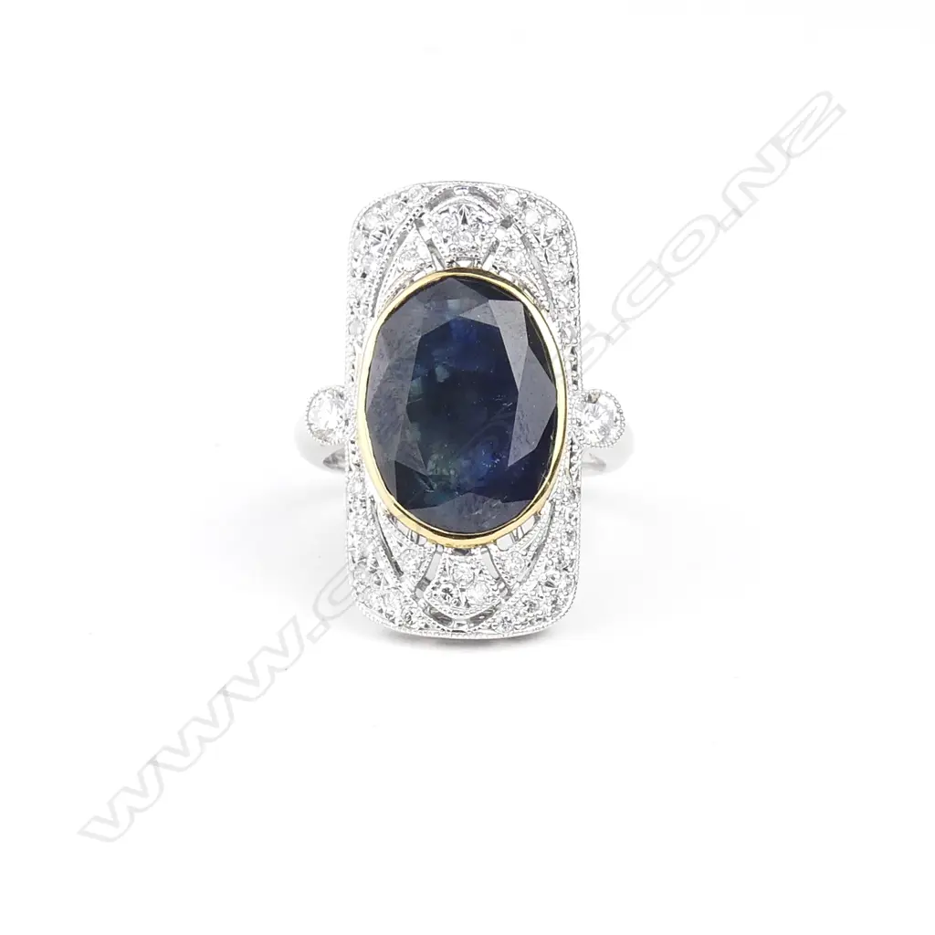 A platinum and 18ct white gold sapphire and diamond Art Deco style ring Image 1++