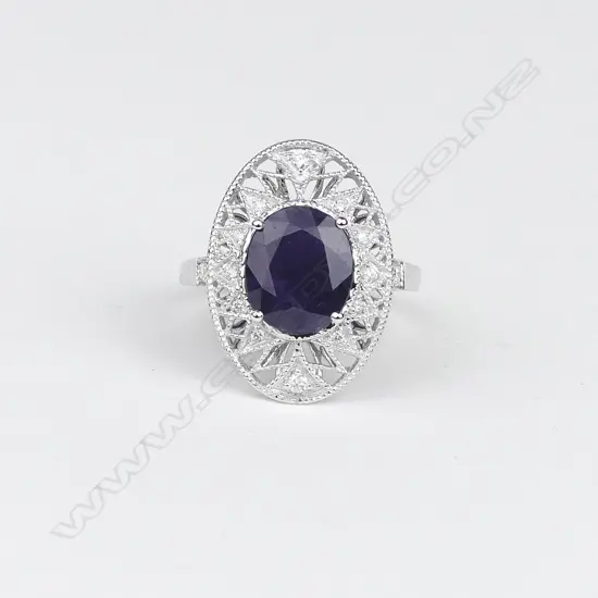 An 18ct white gold sapphire and diamond Art Deco style ring