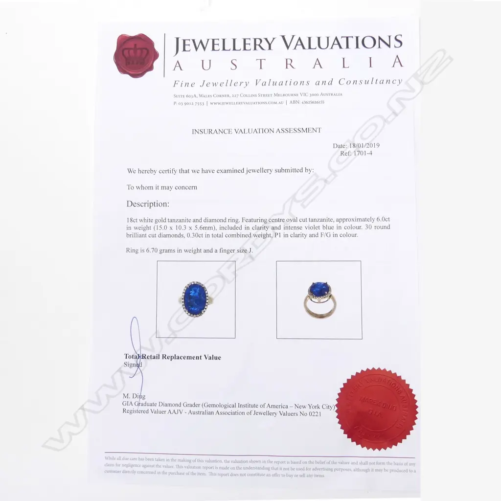 An 18ct white gold tanzanite and diamond ring Image 1++