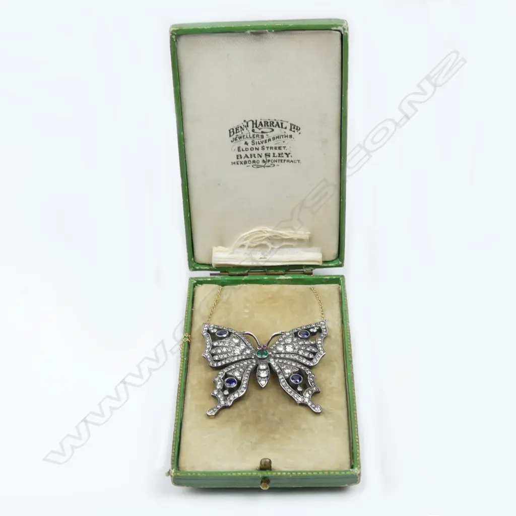 A gold and silver diamond encrusted butterfly pendant Image 1++