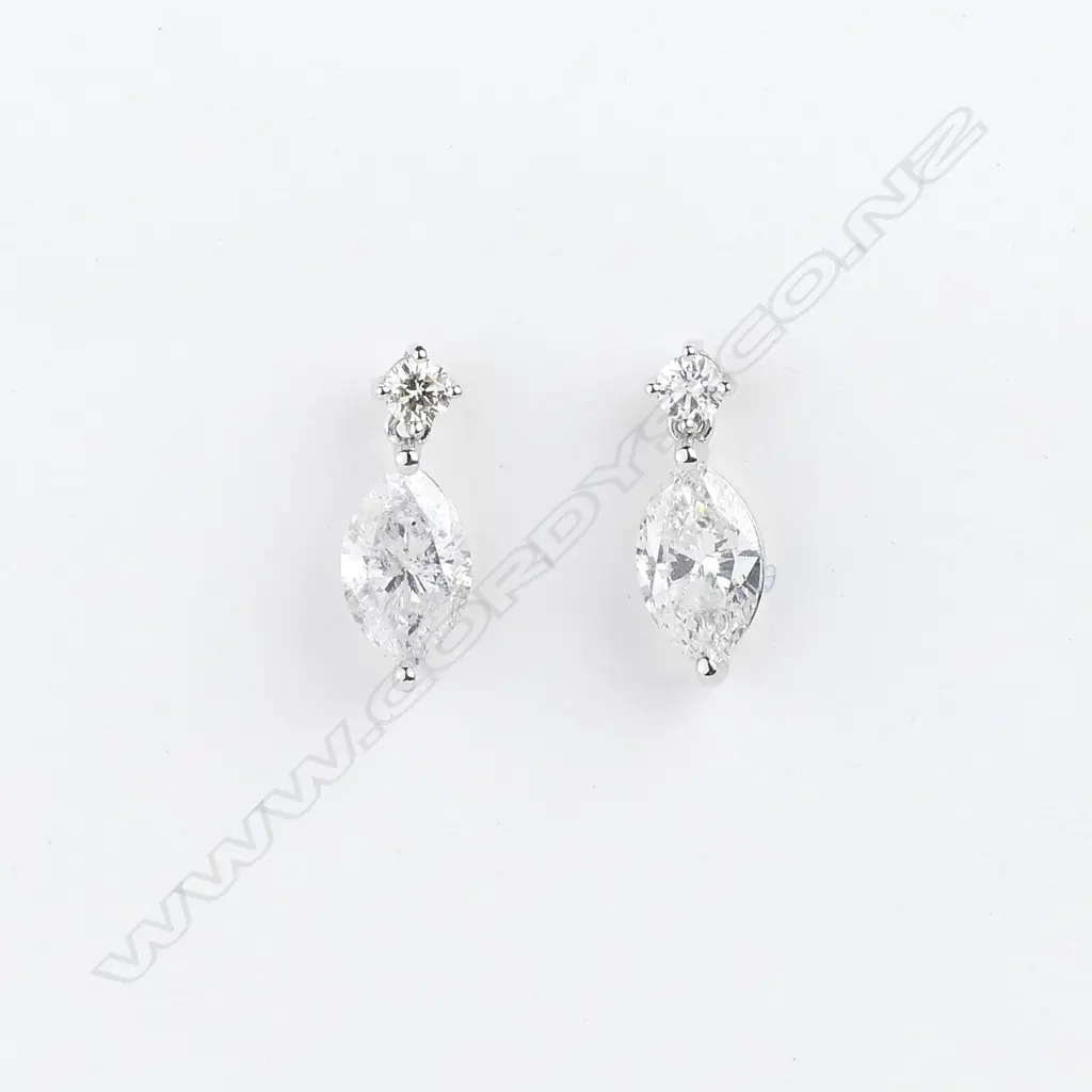 A pair of 14ct white gold and diamond drop earrings Image 1++