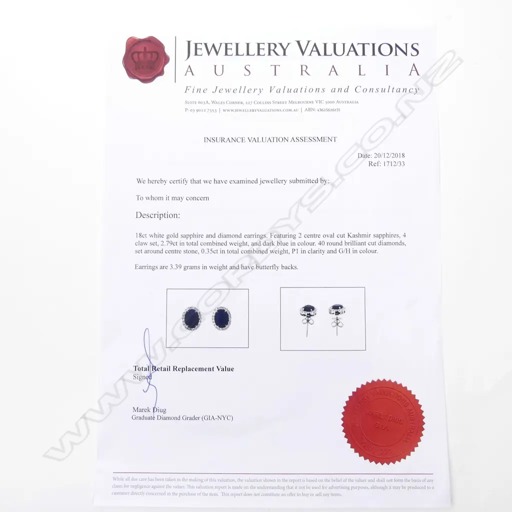 A pair of 18ct white gold sapphire and diamond stud earrings Image 1++