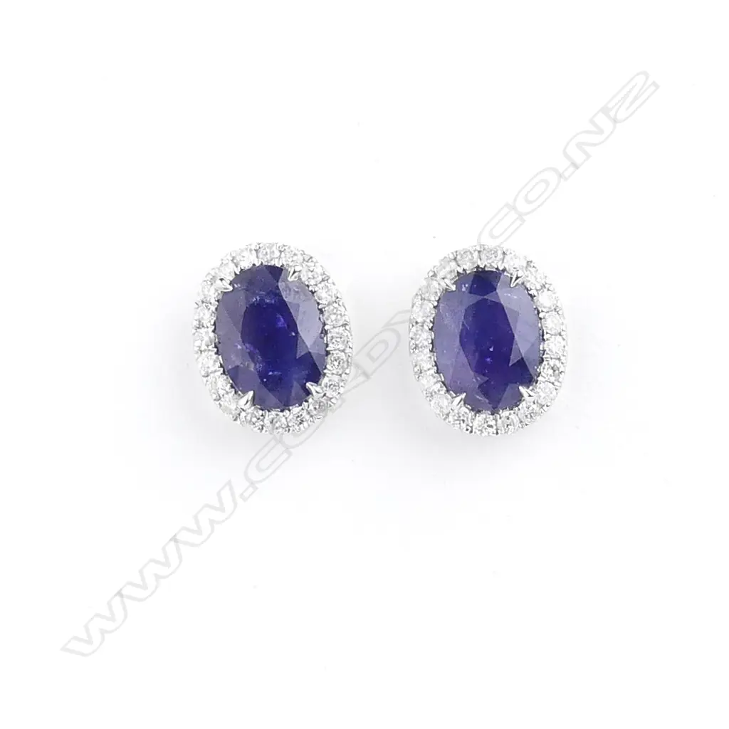 A pair of 18ct white gold sapphire and diamond stud earrings Image 1++