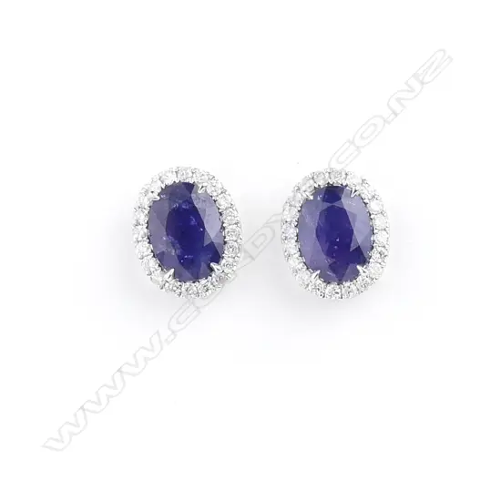 A pair of 18ct white gold sapphire and diamond stud earrings