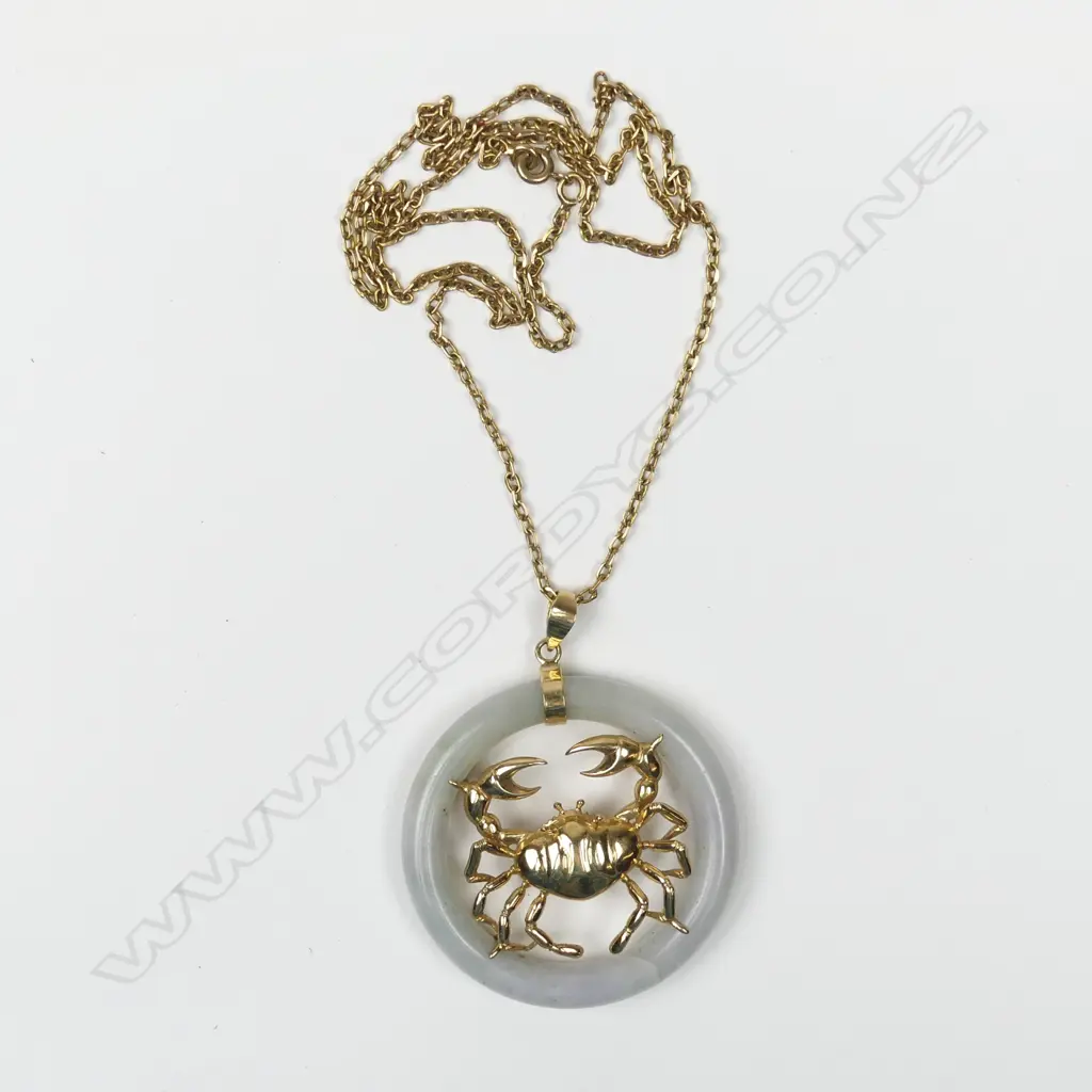 A 14ct gold and jade pendant Image 1++