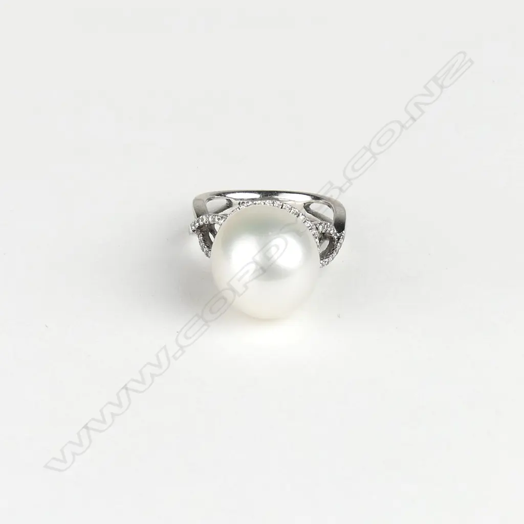 An 18ct. white gold large pearl and diamond lady's dress ring Image 1++
