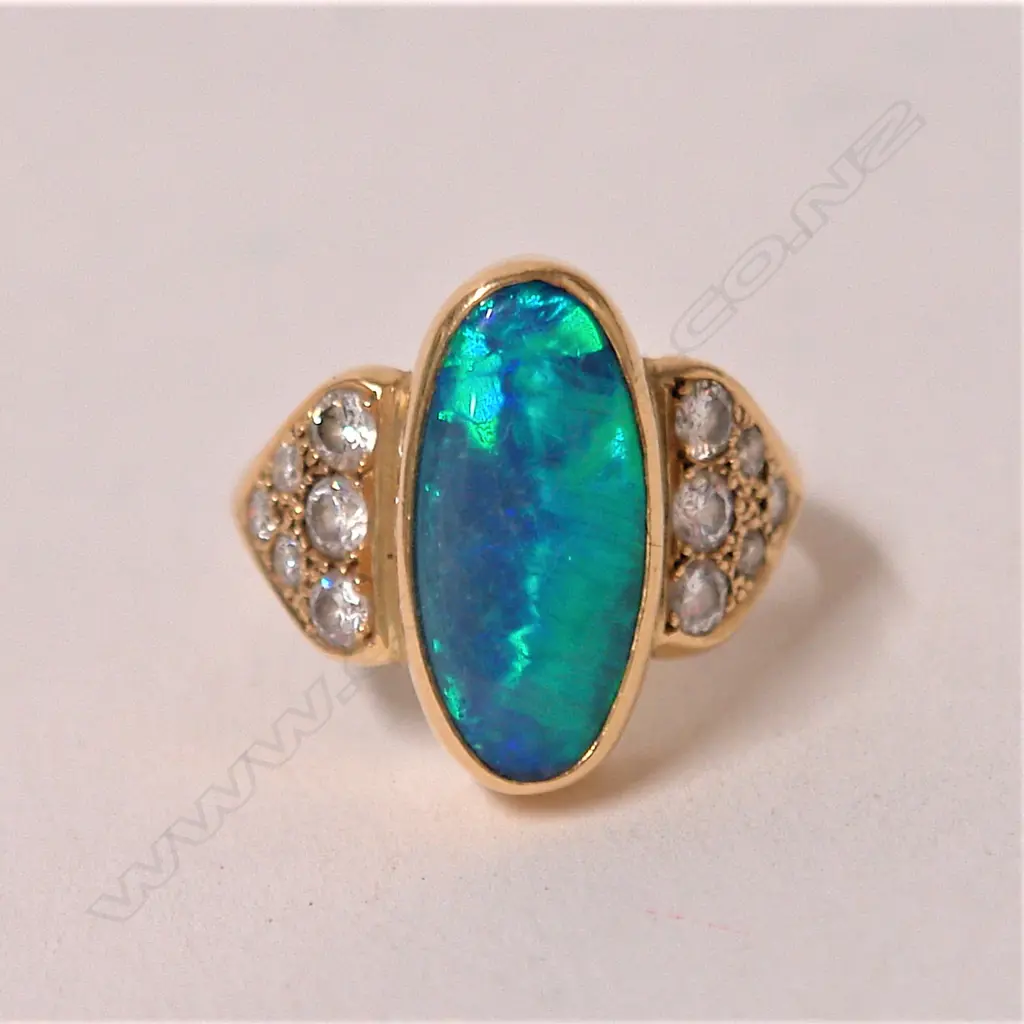 A vintage 18ct. yellow gold opal and diamond dress ring Image 1++
