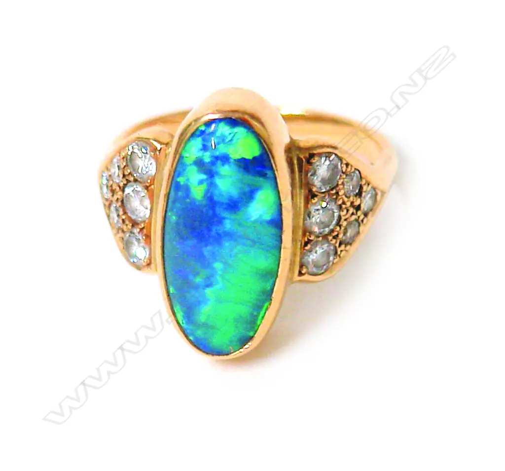 A vintage 18ct. yellow gold opal and diamond dress ring Image 1++
