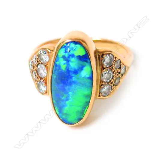 A vintage 18ct. yellow gold opal and diamond dress ring