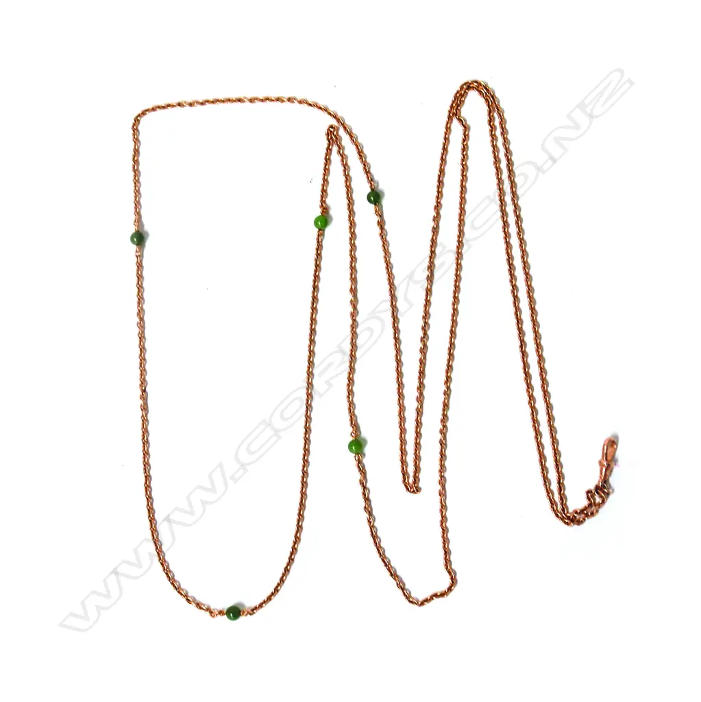 A good early 20thC 15ct. rose gold and greenstone highlighted muff chain Image 1++