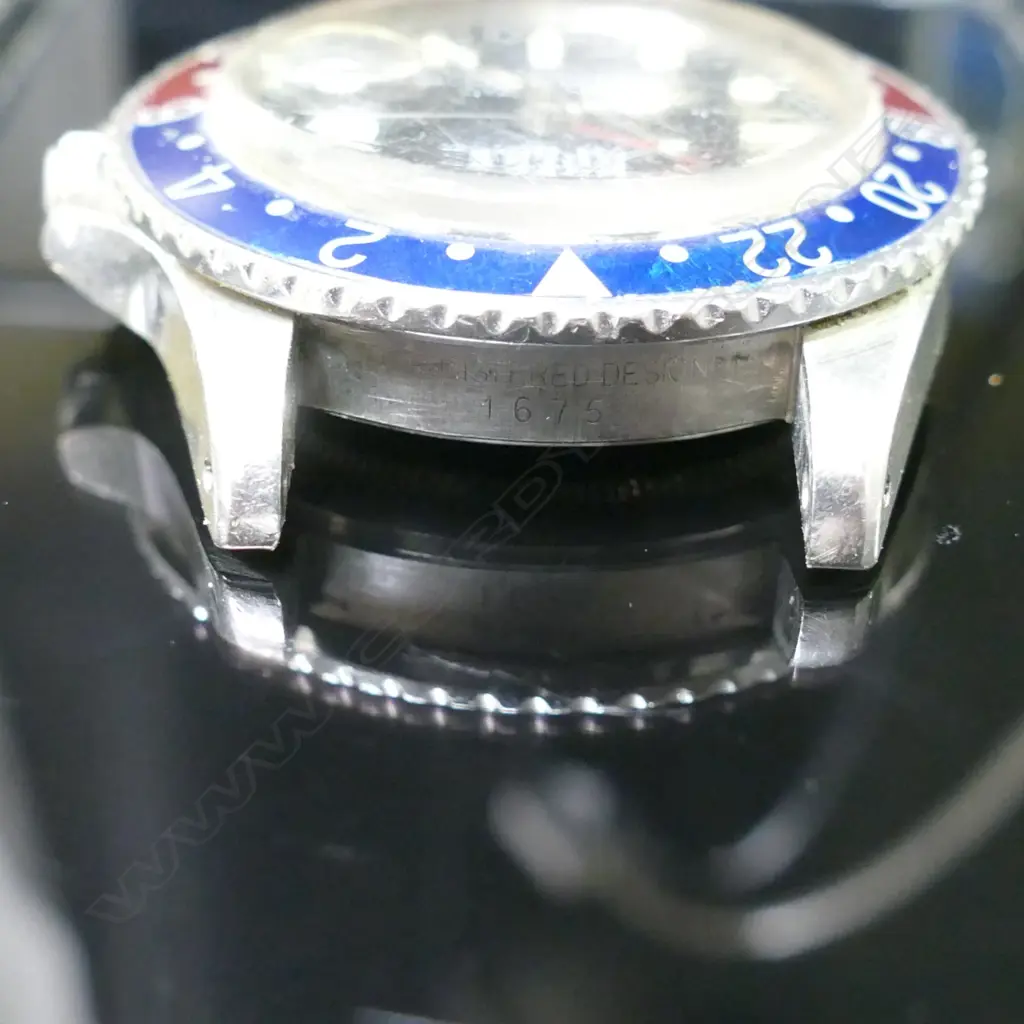 A Rolex Oyster Perpetual GMT-Master 'Pepsi' bezel 'Superlative Chronometer' wristwatch Image 1++