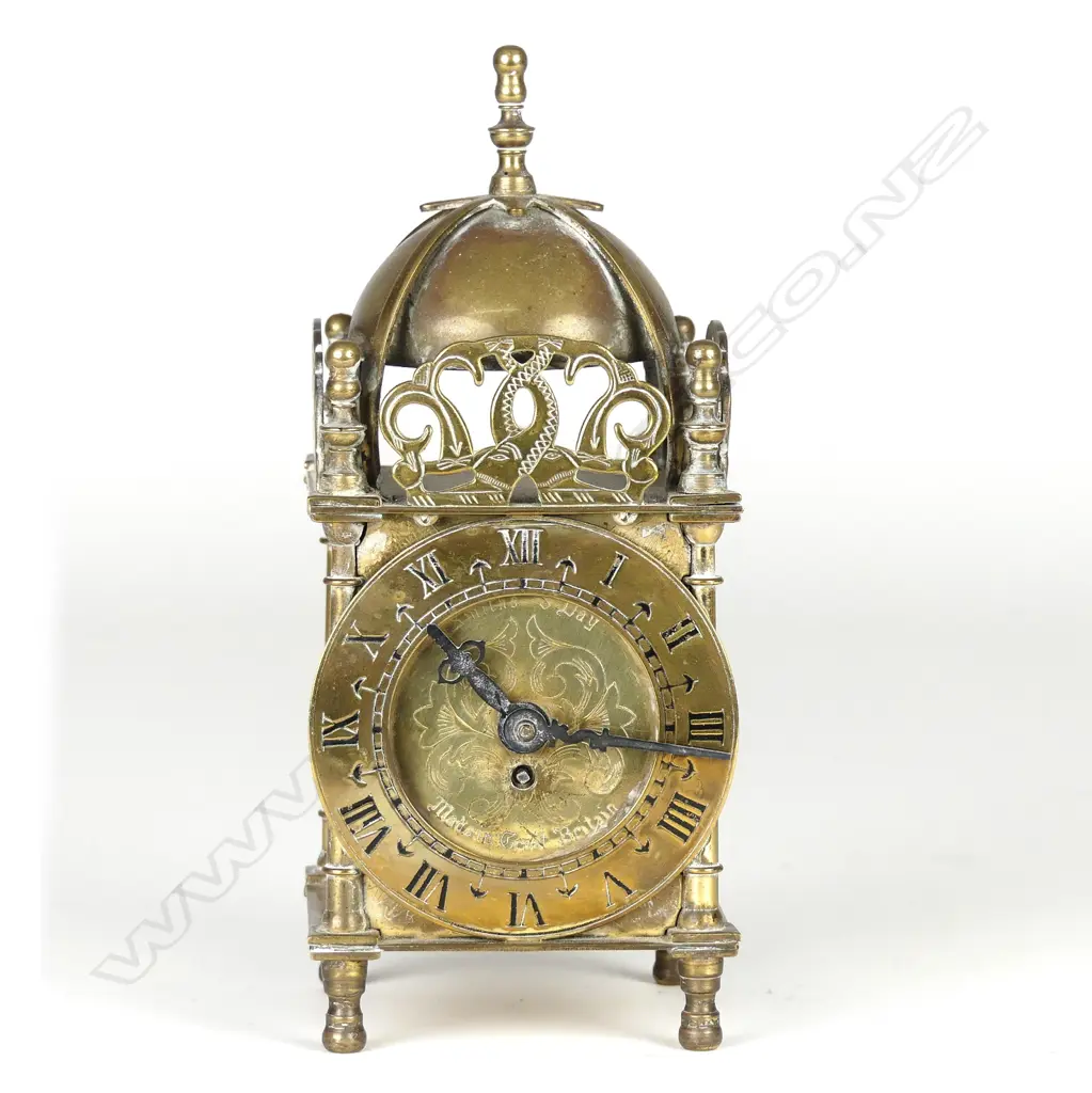 A Smith's British brass cased miniature lantern clock Image 1++