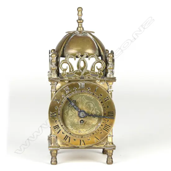 A Smith's British brass cased miniature lantern clock