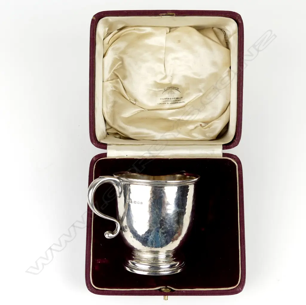 A silver mug Image 1++