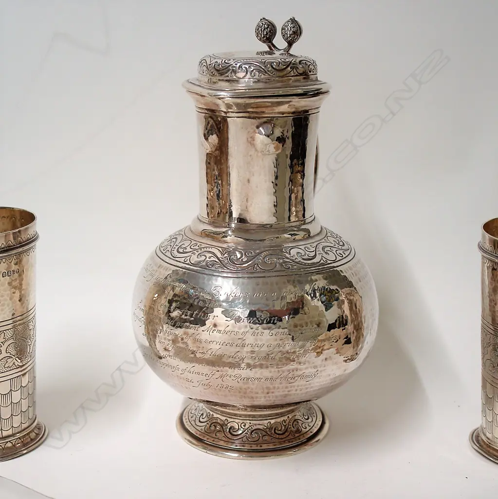 A large heavy and impressive Victorian presentation silver jug and two beakers Image 1++