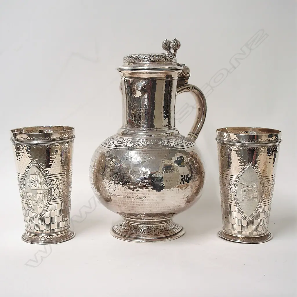 A large heavy and impressive Victorian presentation silver jug and two beakers Image 1++