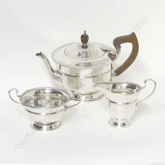 A three piece silver tea set